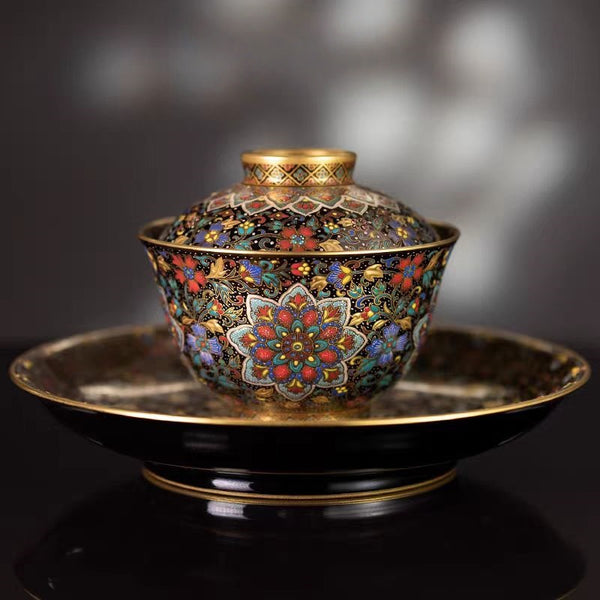 Premium Mirror Black Glaze Enamel with Gold and Silver Inlay and Famille Rose 'Interlocking Blossoms and Falling Petals' Lidded Tea Bowl